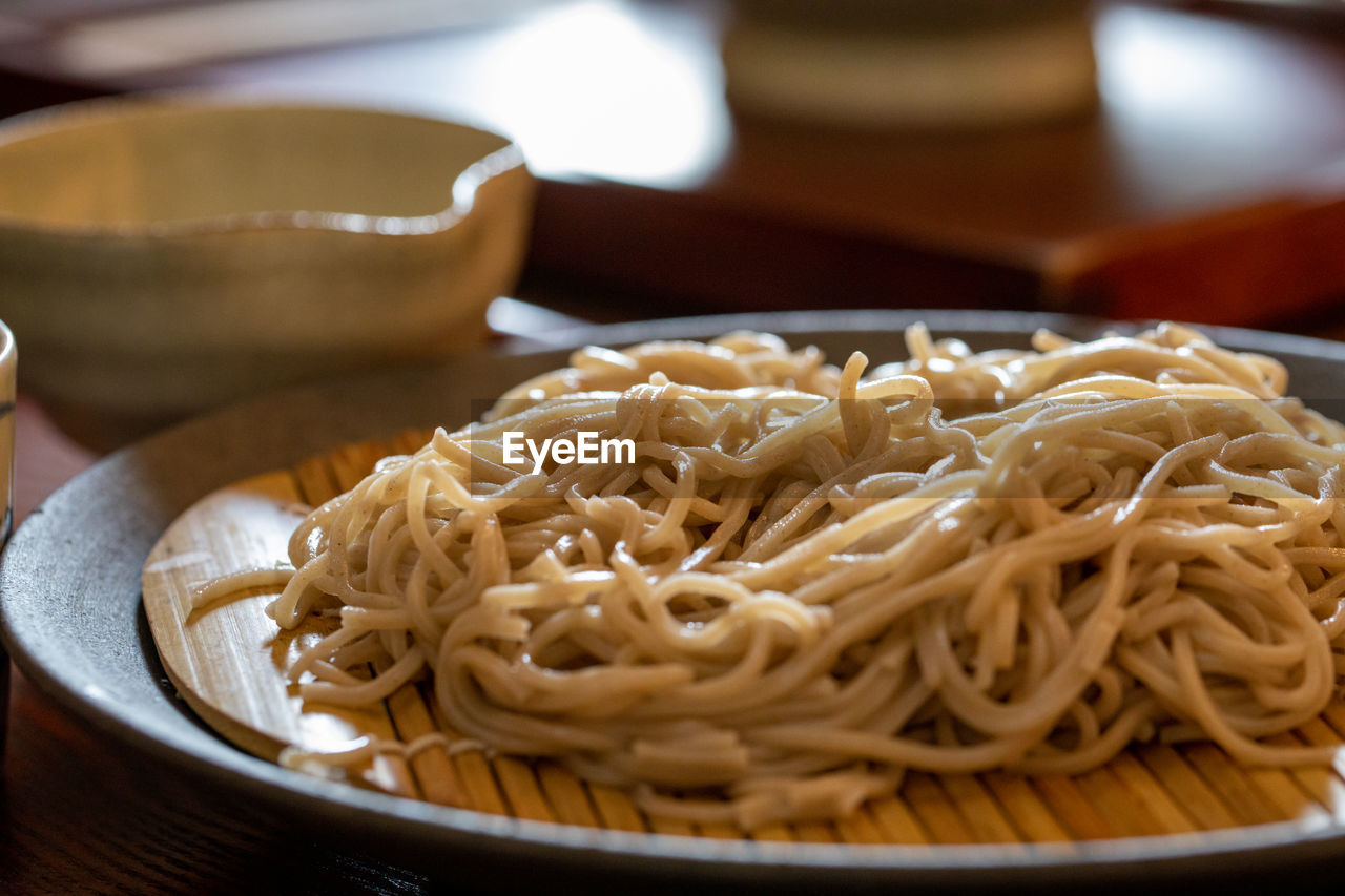 Close-up of noodles in bowl on table