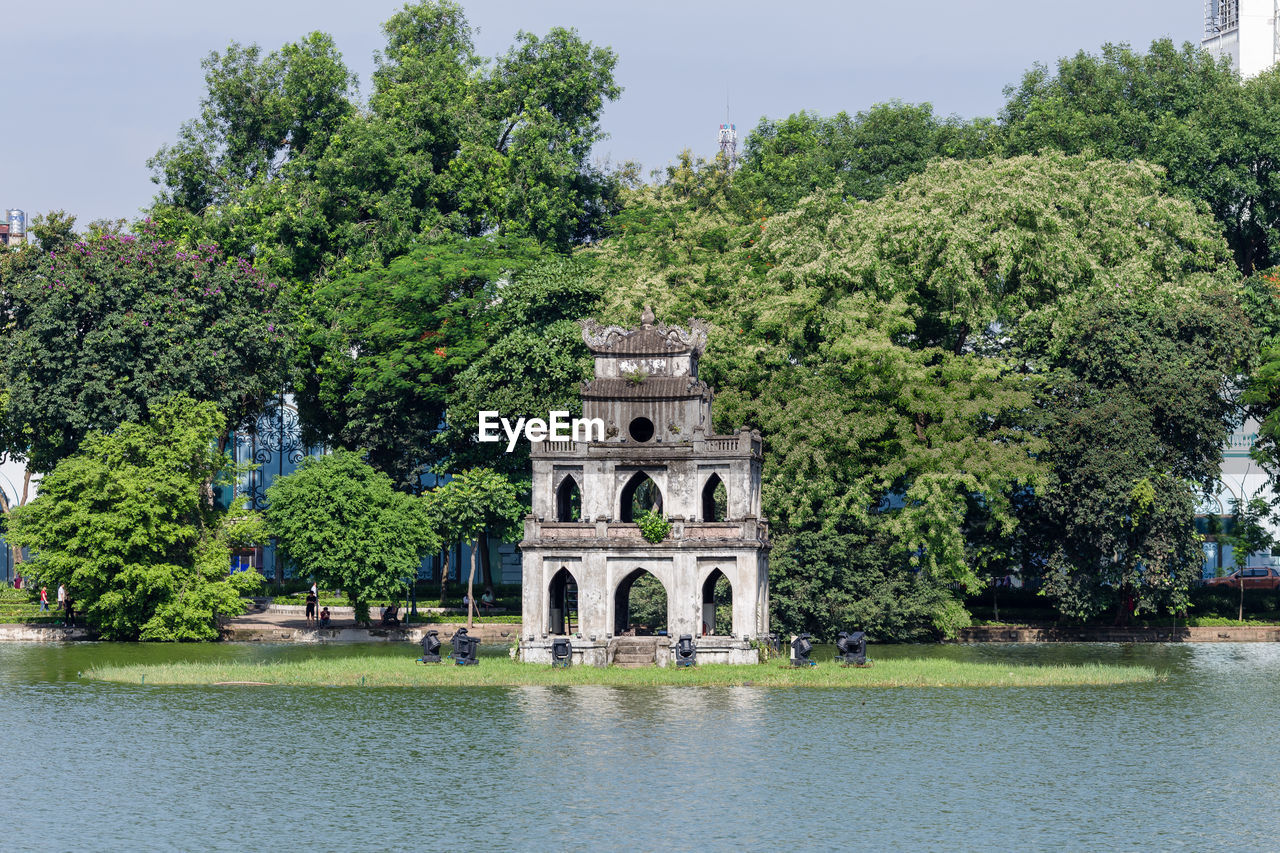 VIEW OF CASTLE BY LAKE