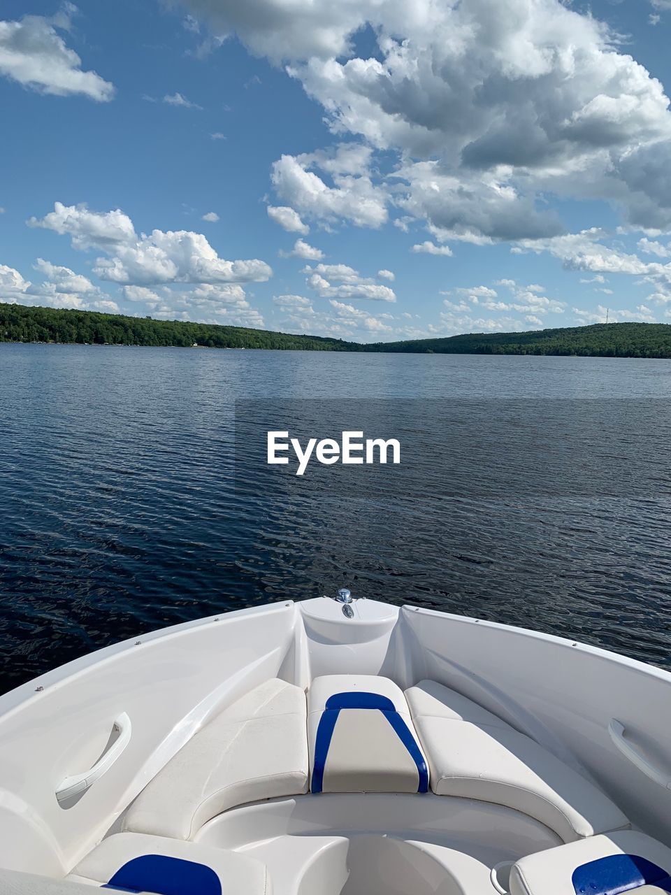 VIEW OF LAKE AGAINST CLOUDY SKY