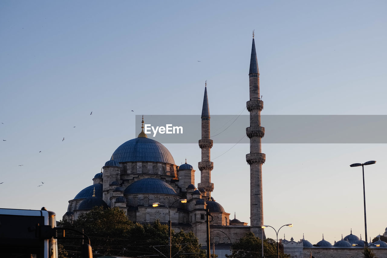 low angle view of mosque against clear blue sky