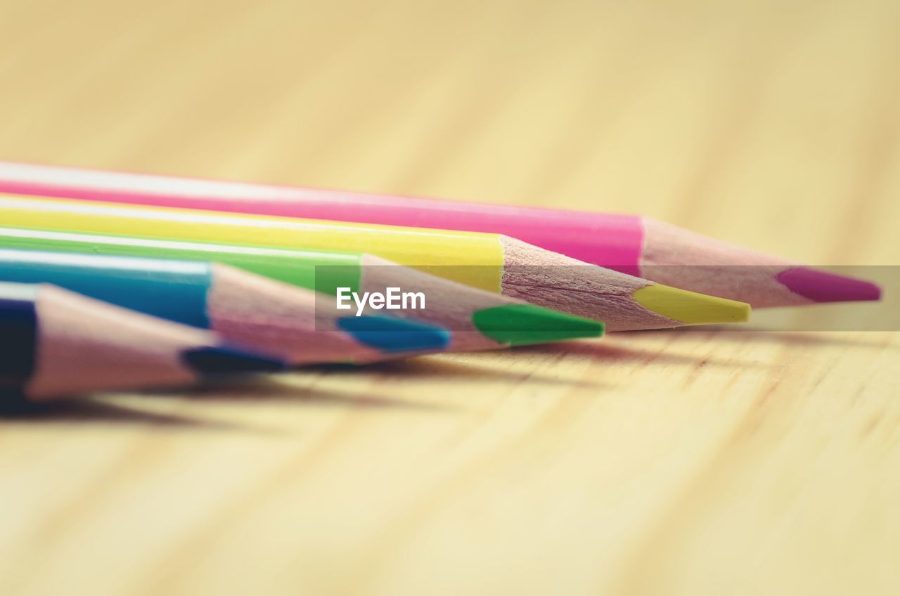 Close-up of colored pencils on desk