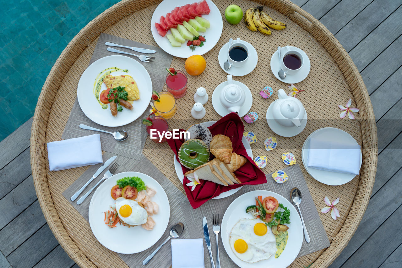 HIGH ANGLE VIEW OF MEAL SERVED ON TABLE