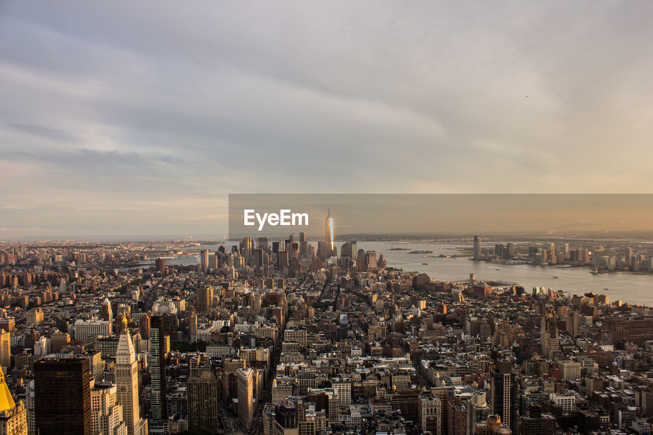 High angle view of city at sunset