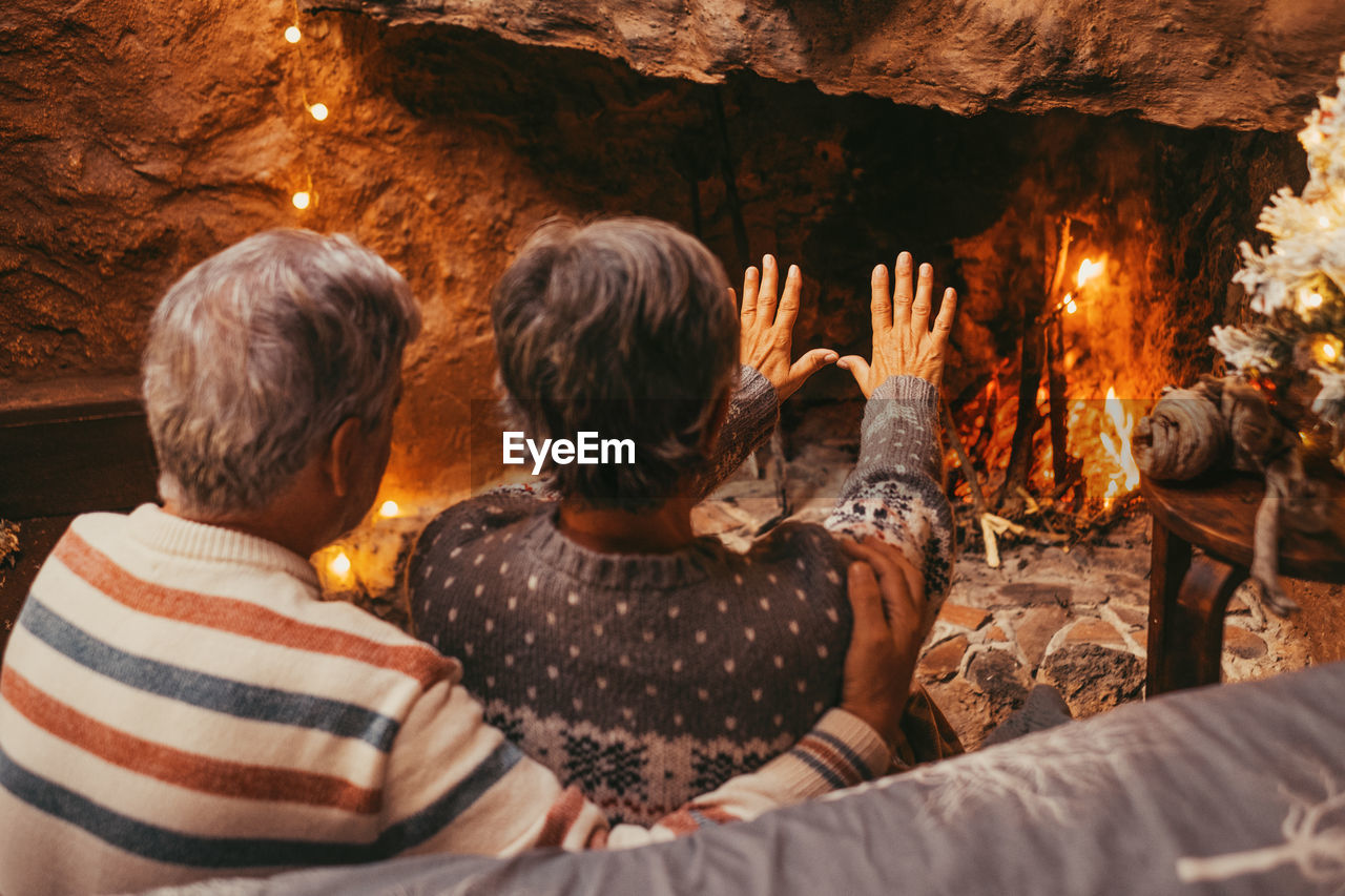 rear view of woman sitting in cave