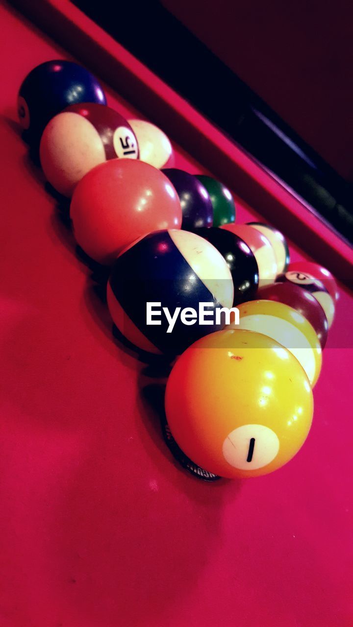 Close-up of pool balls arranged on table