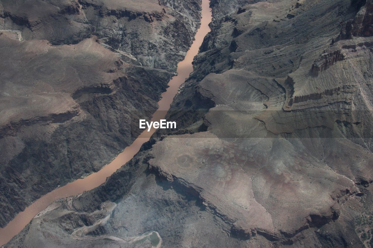 Aerial view of river amidst mountains