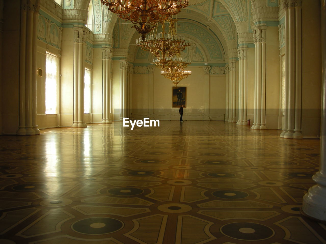 VIEW OF ILLUMINATED CHANDELIER IN BUILDING