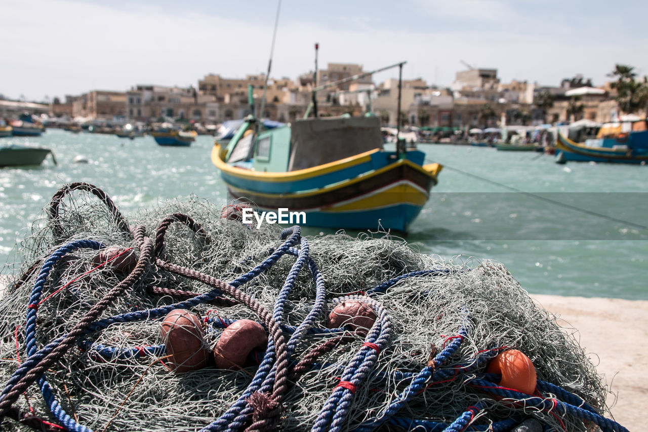 Fishing boats moored at harbor