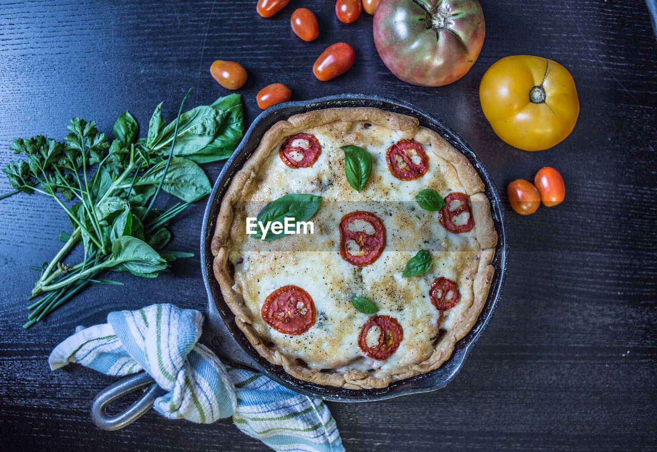 High angle view of pizza served on table