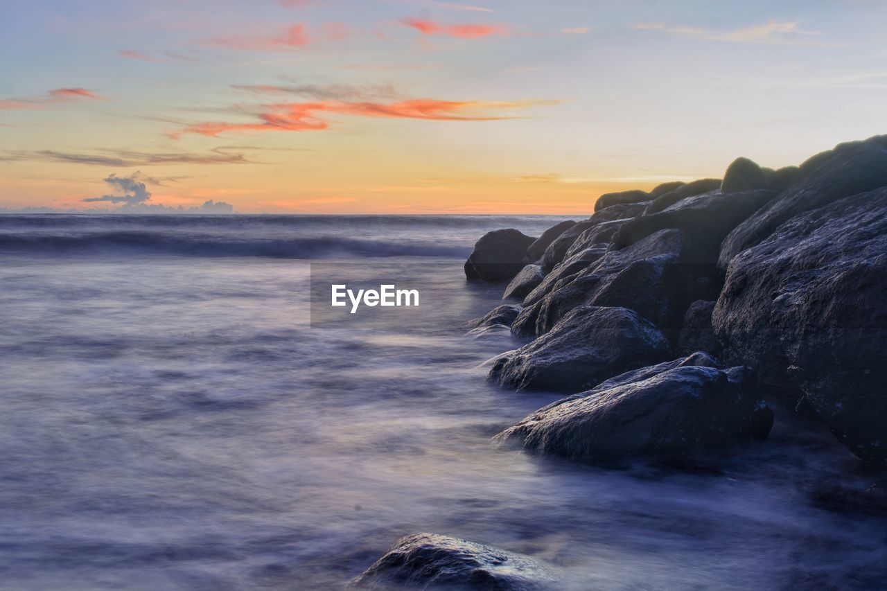 Scenic view of sea against sky during sunset