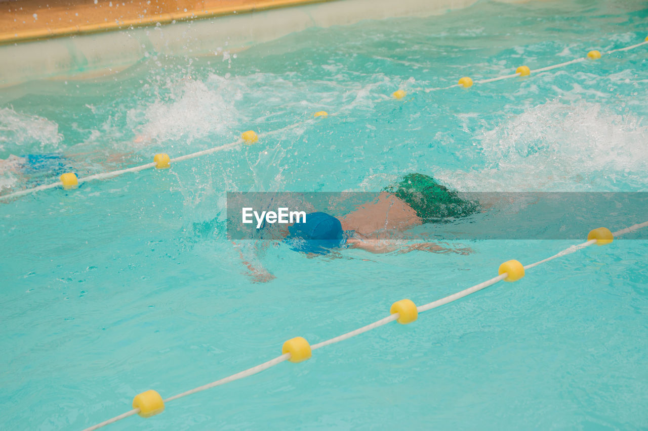 High angle view of person swimming in pool