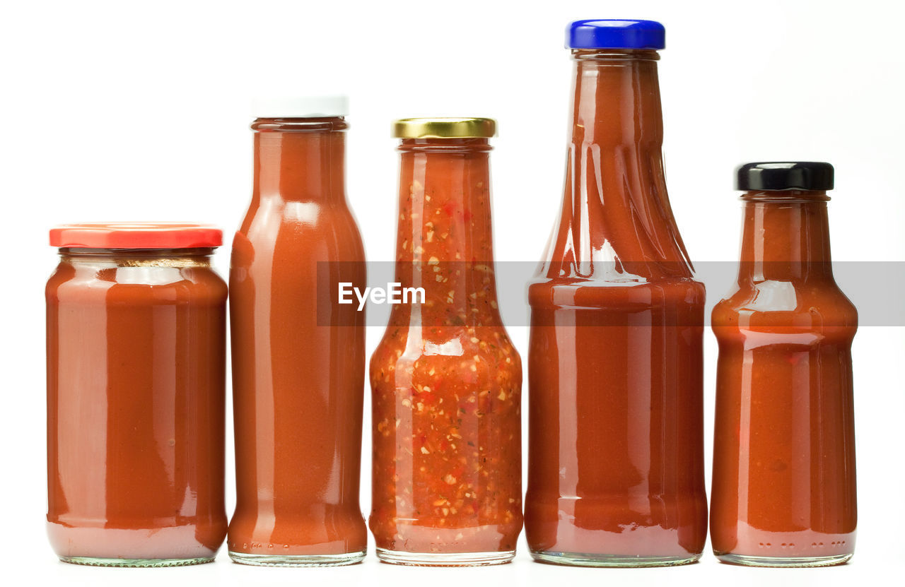 Close-up of bottles against white background