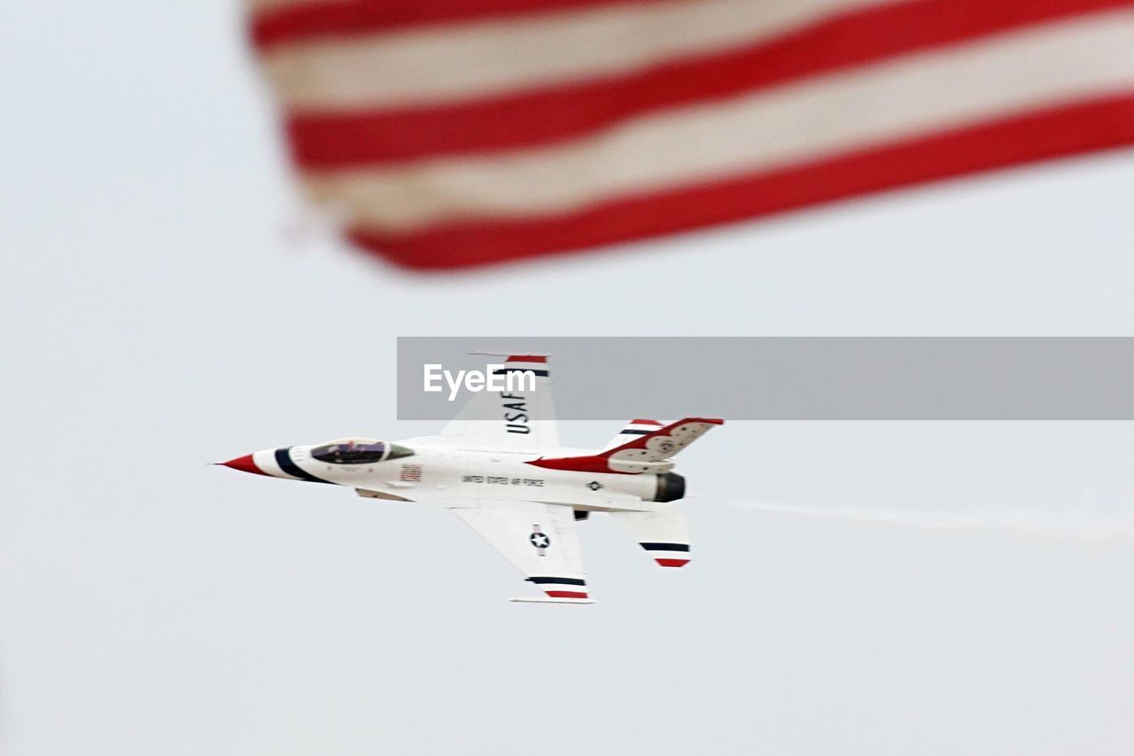 airplane, airshow, transportation, flying, performance, military, air force, no people, air vehicle, formation flying, day, sky, red, teamwork, fighter plane, military airplane, outdoors, aerospace industry, aerobatics