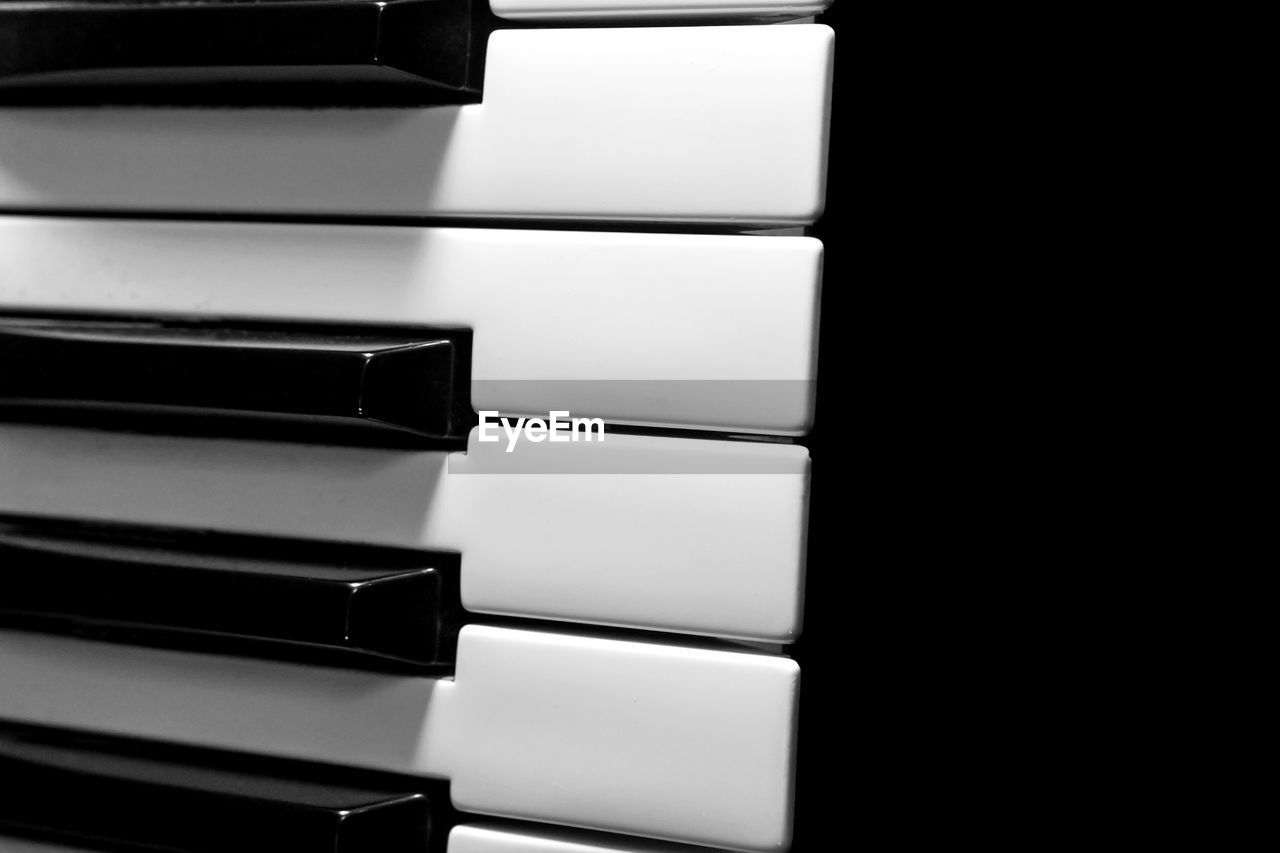 piano, keyboard, musical instrument, indoors, piano key, black, no people, musical keyboard, string instrument, music, arts culture and entertainment, close-up, digital piano, musical equipment, black and white, in a row, still life, computer component