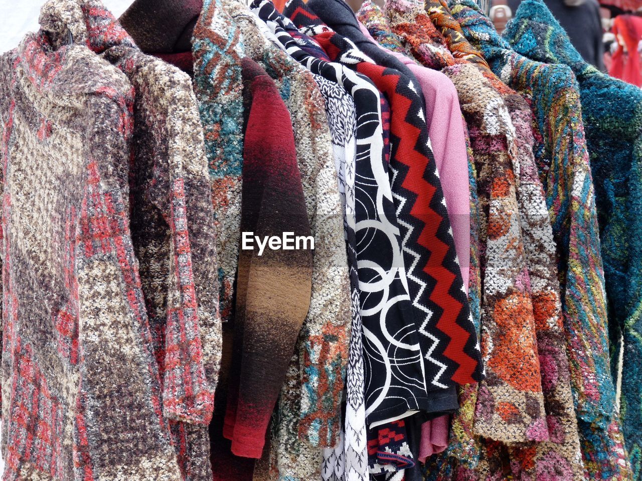 Close-up of clothes hanging on display at store