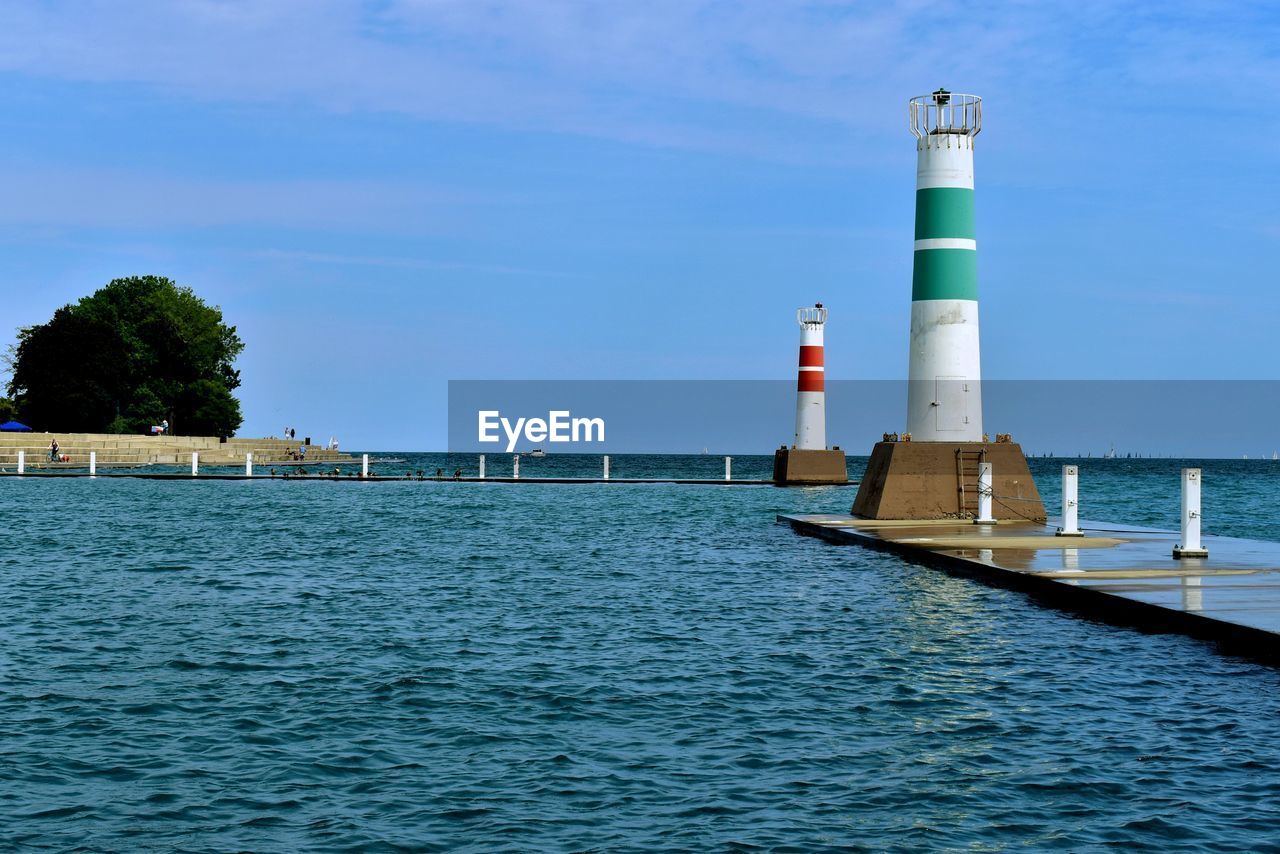 Towers by lake against sky.  enterance to montrose harbor, chicago, il. 