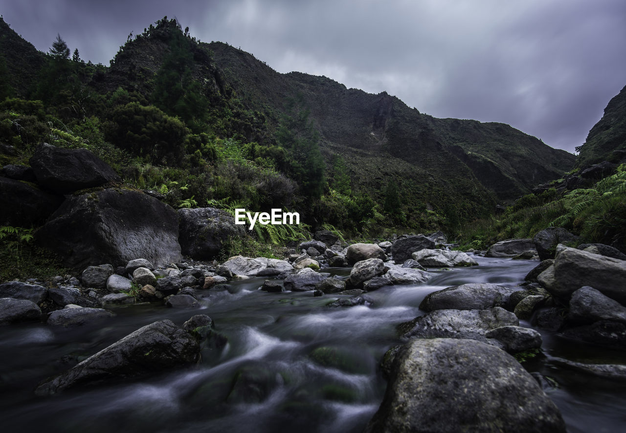 River flowing by mountain