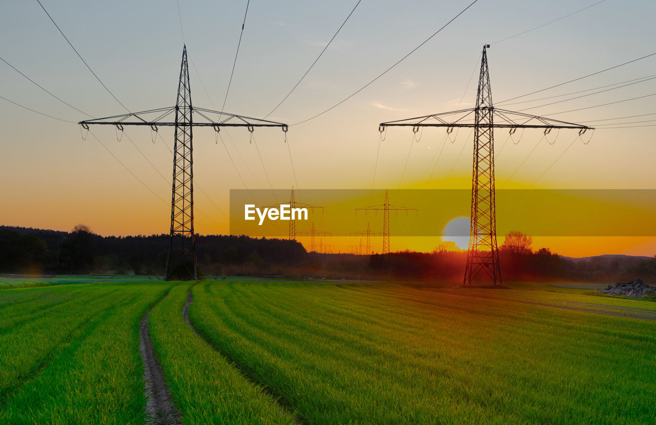 Scenic view of field against sky during sunset