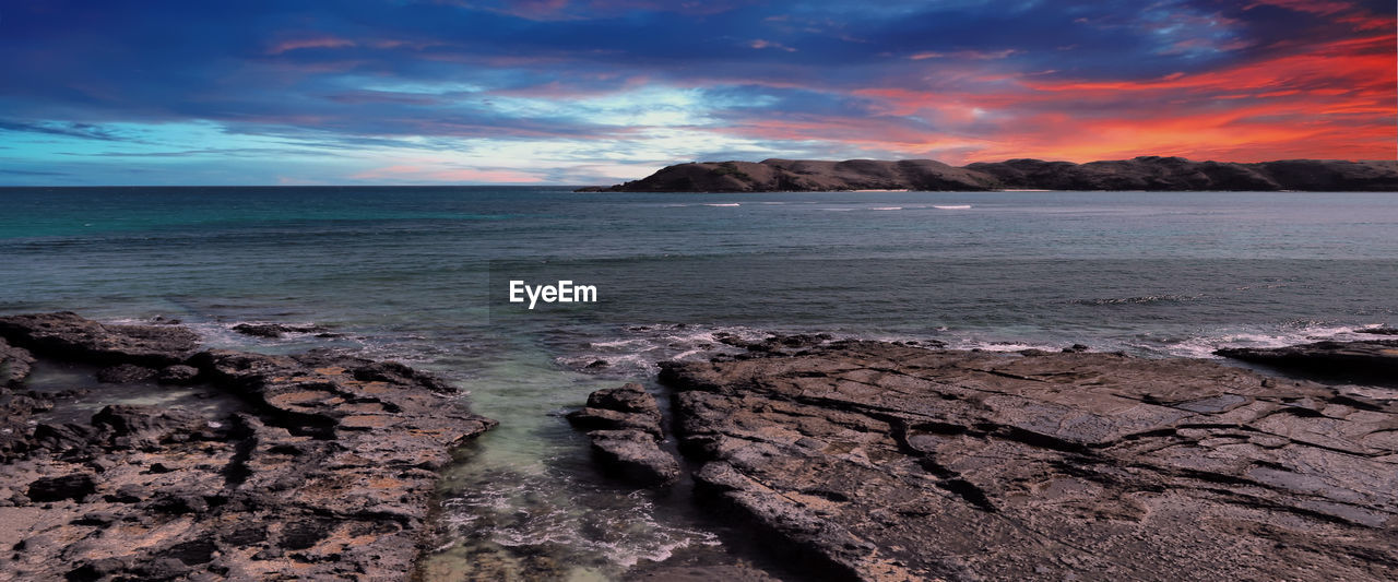 Scenic view of sea against sky during sunset