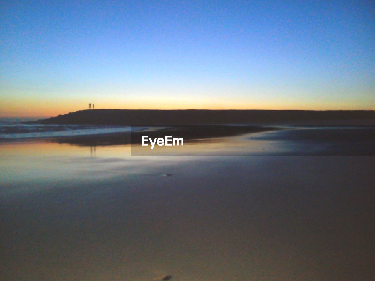 VIEW OF BEACH AT SUNSET