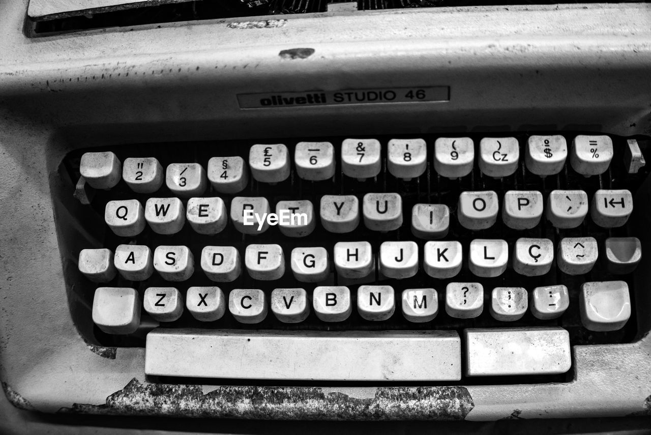 typewriter, black and white, technology, text, retro styled, monochrome, number, letter, alphabet, monochrome photography, communication, office equipment, old, close-up, black, no people, automotive exterior, indoors, western script, office supplies, machinery, business, finance, high angle view, history, keyboard, the past, computer keyboard, document, equipment, calculator, paper