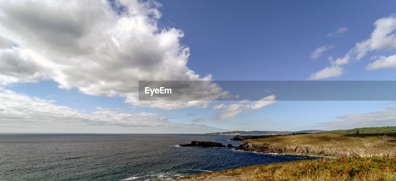 Scenic view of sea against blue sky