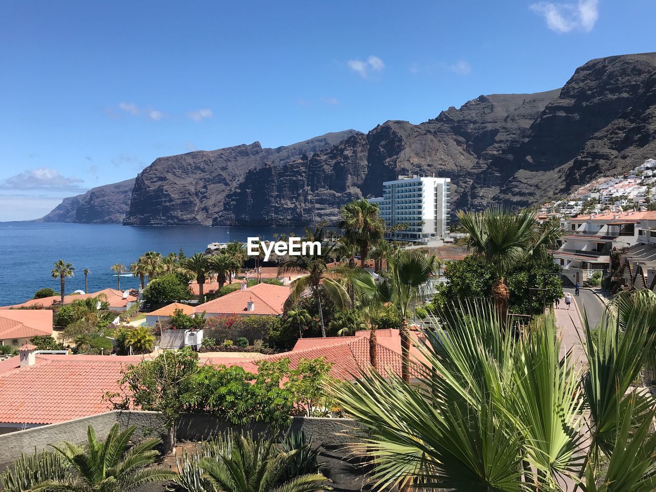 Scenic view of sea and buildings against sky