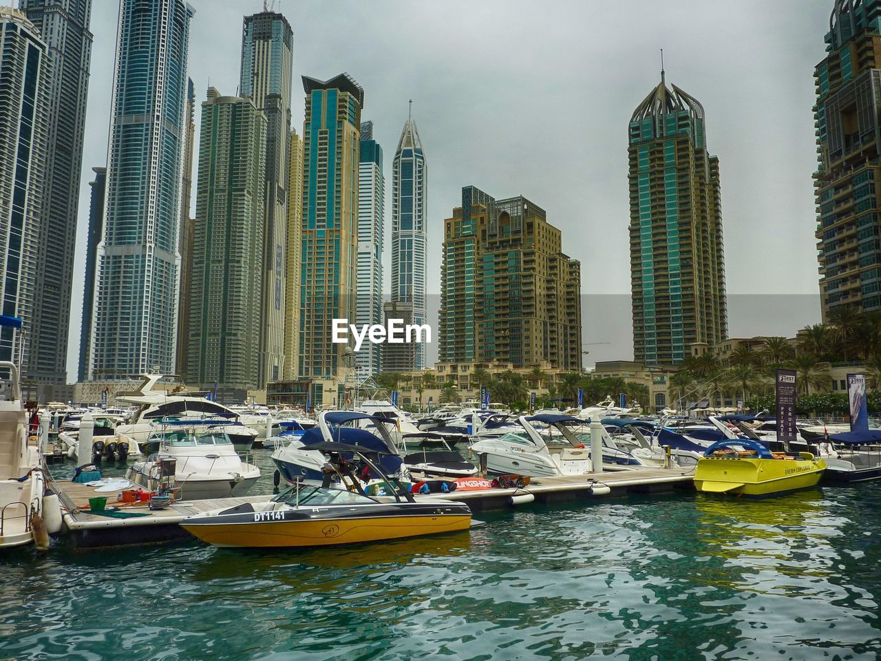 Boats moored at harbor