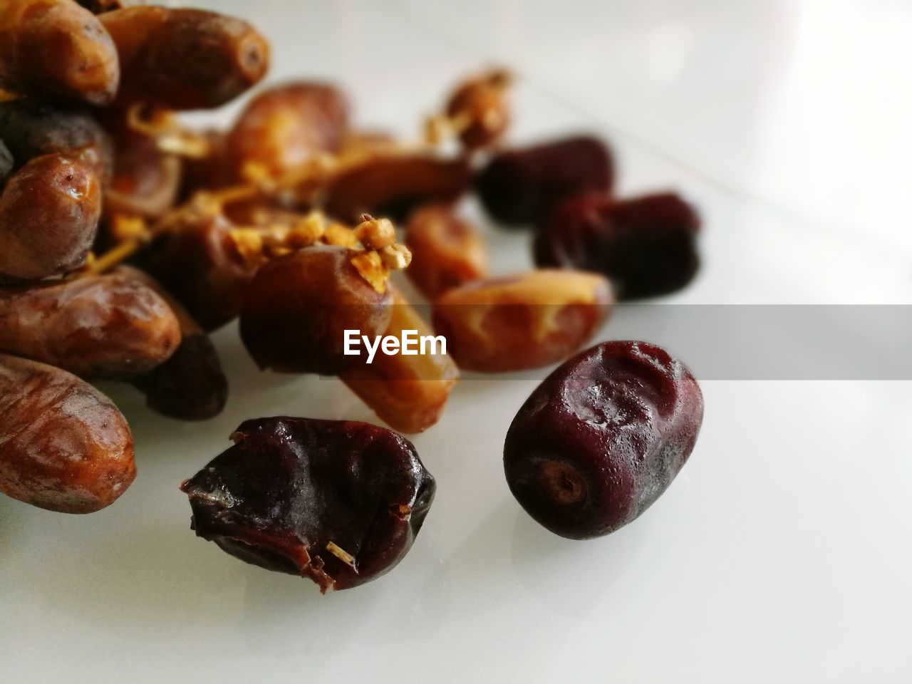 CLOSE-UP OF FOOD ON WHITE SURFACE