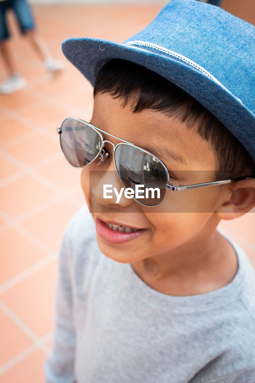 Close-up of boy wearing sunglasses