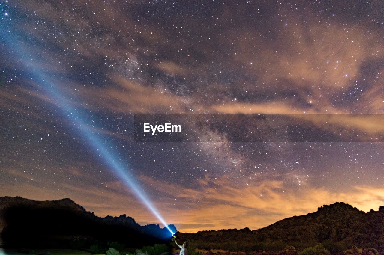 Scenic view of star field against sky at night