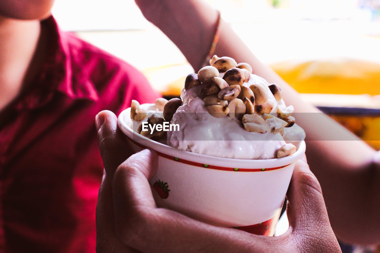 Close-up of people having ice cream