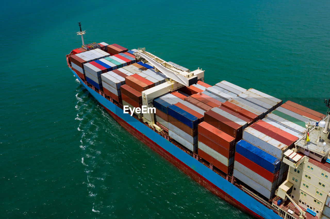 High angle view of shipping cargo containers logistics international sailing on sea