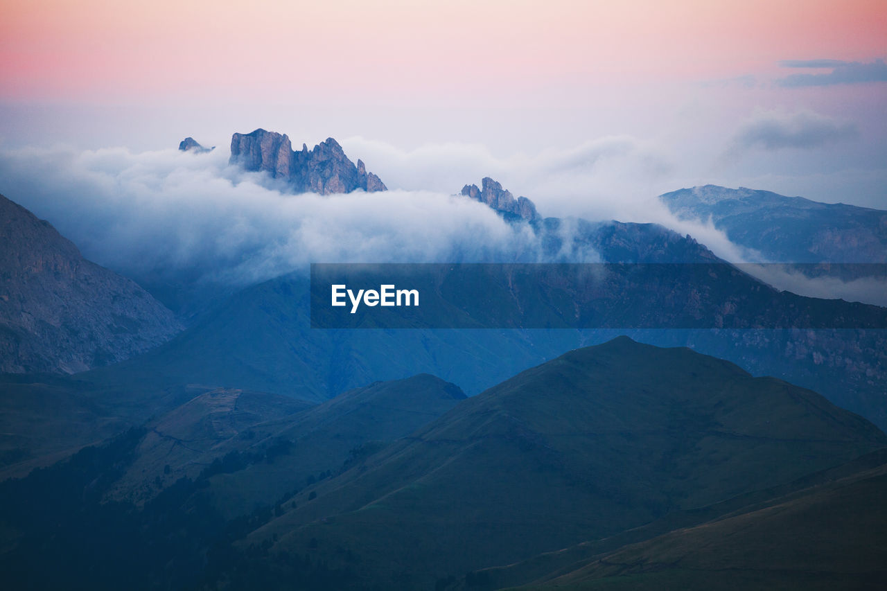 Scenic view of mountains against sky during sunset