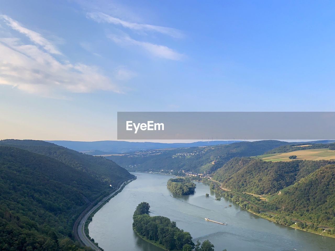 High angle view of river amidst landscape against sky