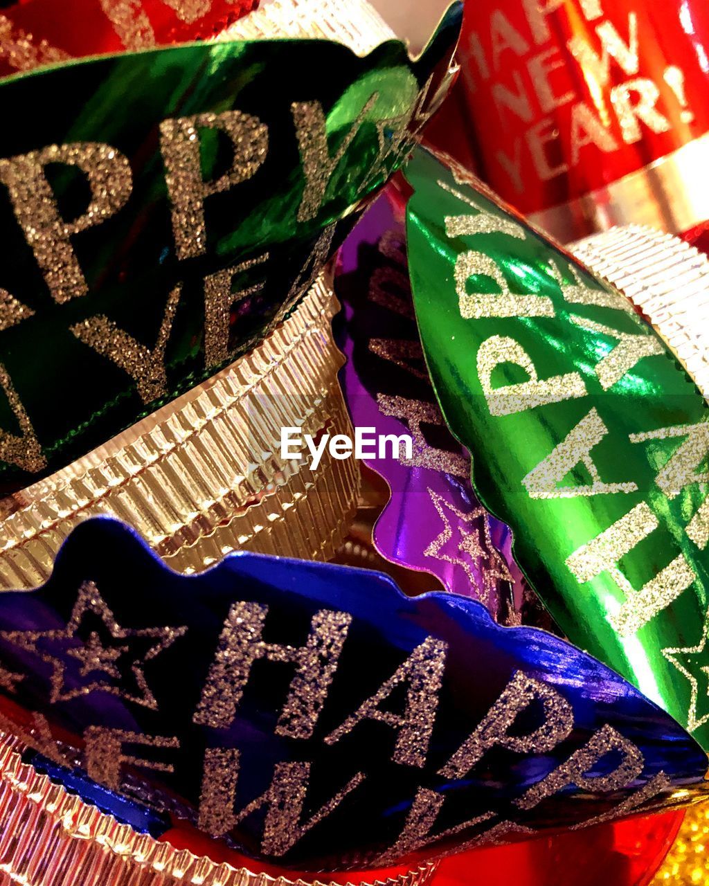 CLOSE-UP OF MULTI COLORED TEXT HANGING ON CLOTHESLINE