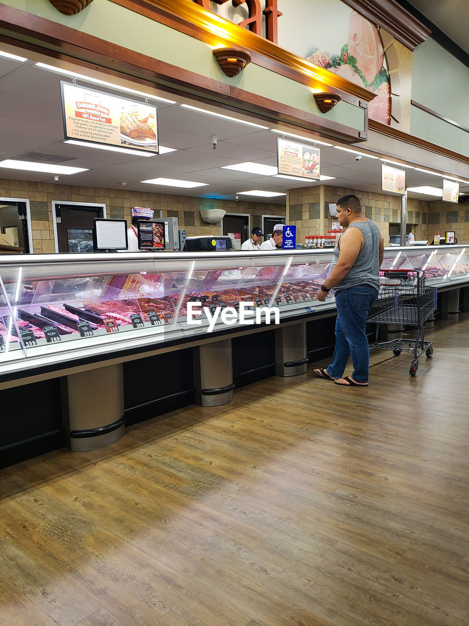 MAN STANDING IN STORE