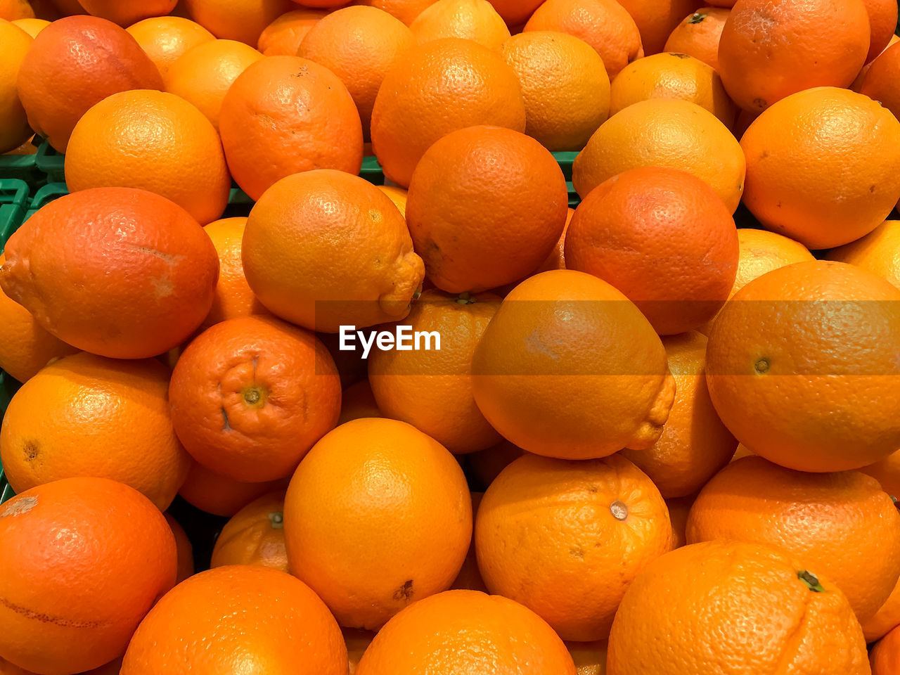 Full frame shot of oranges for sale at market