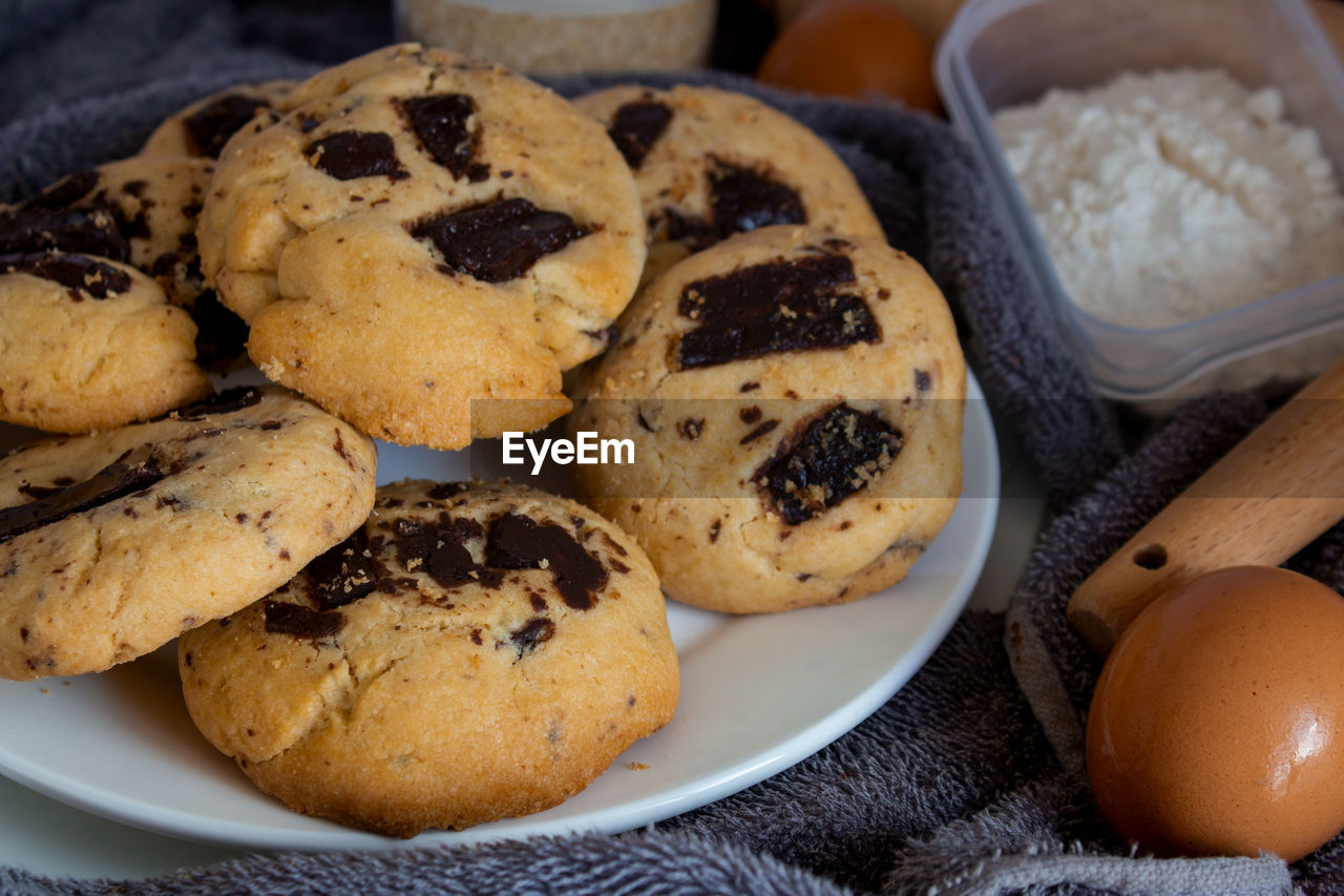 food and drink, food, baked, freshness, sweet food, dessert, no people, chocolate chip, snack, cookie, indoors, produce, sweet, meal, healthy eating, close-up, dish, still life, bread, chocolate chip cookie, chocolate, raisin