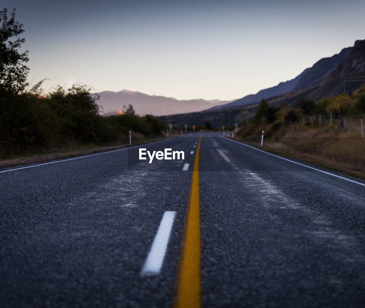 Road by street against clear sky