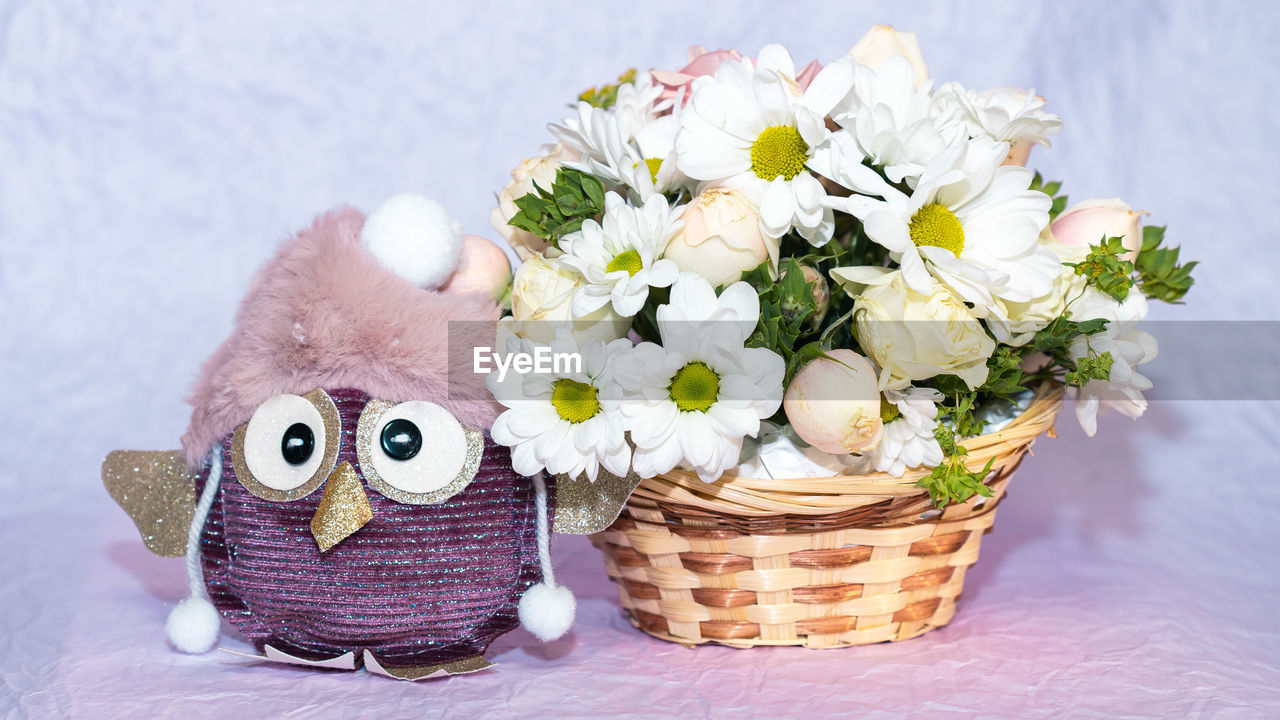 Close-up of flowers in basket on table