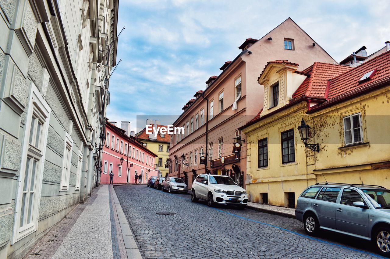 Street amidst buildings against sky