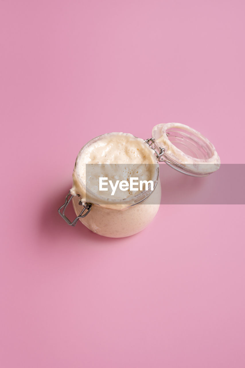 HIGH ANGLE VIEW OF ICE CREAM OVER PINK BACKGROUND