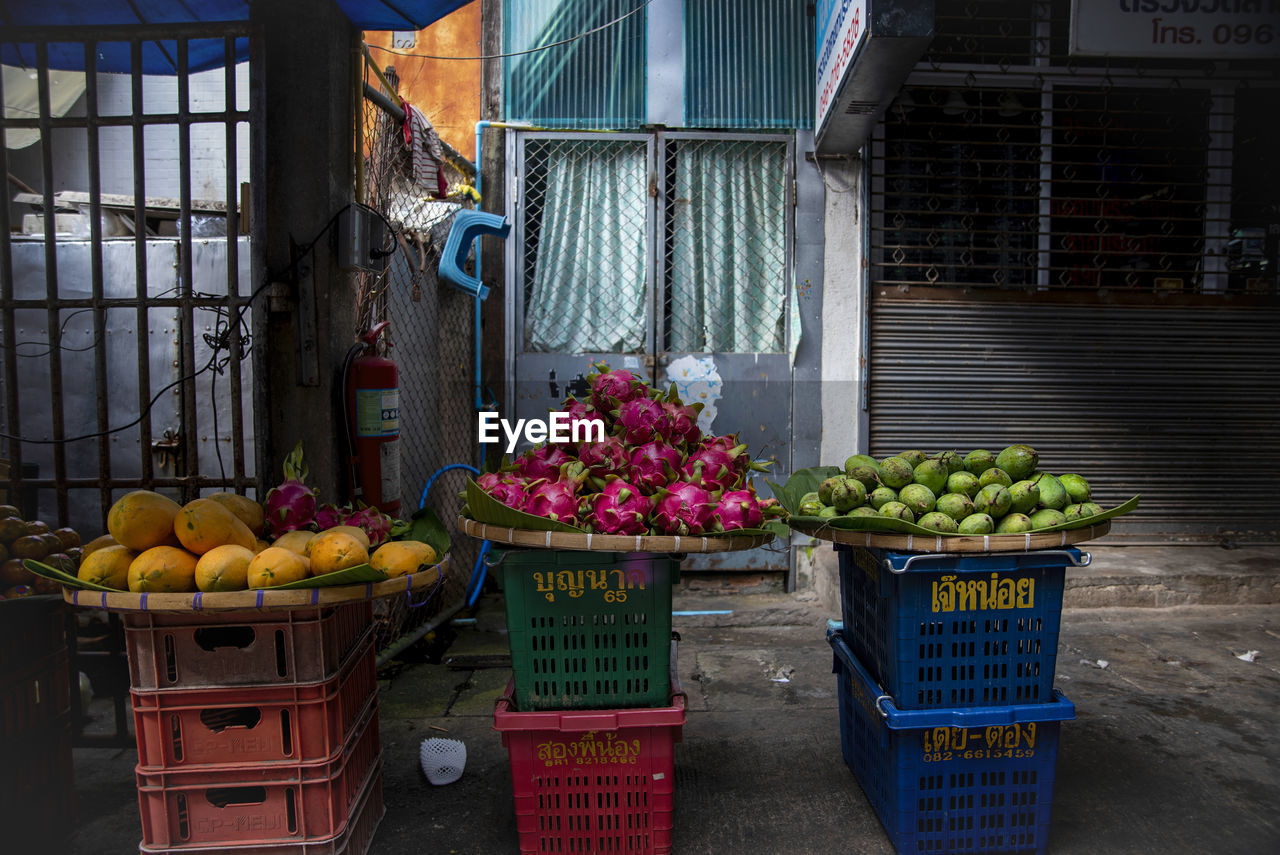 Three fruit baskets in an outdoor market in chiang rai, thailand