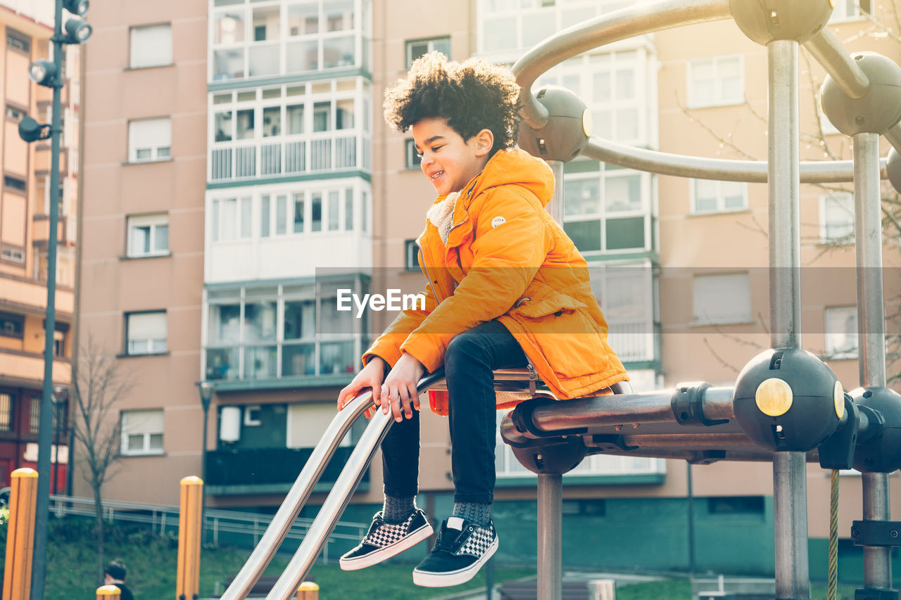 Cute boy enjoying in playground