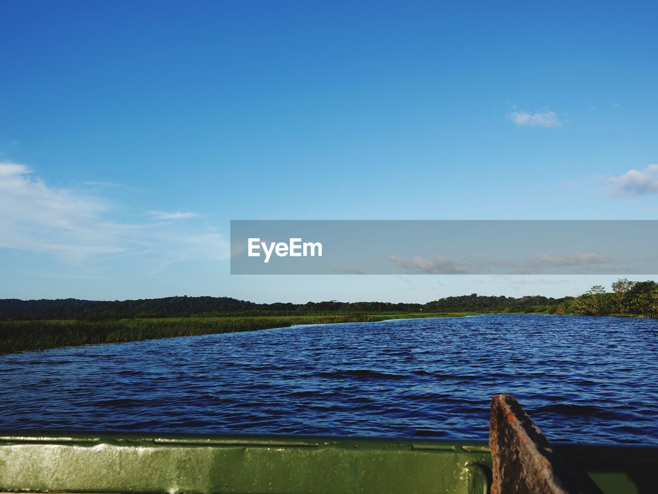 SCENIC VIEW OF BLUE LAKE AGAINST SKY