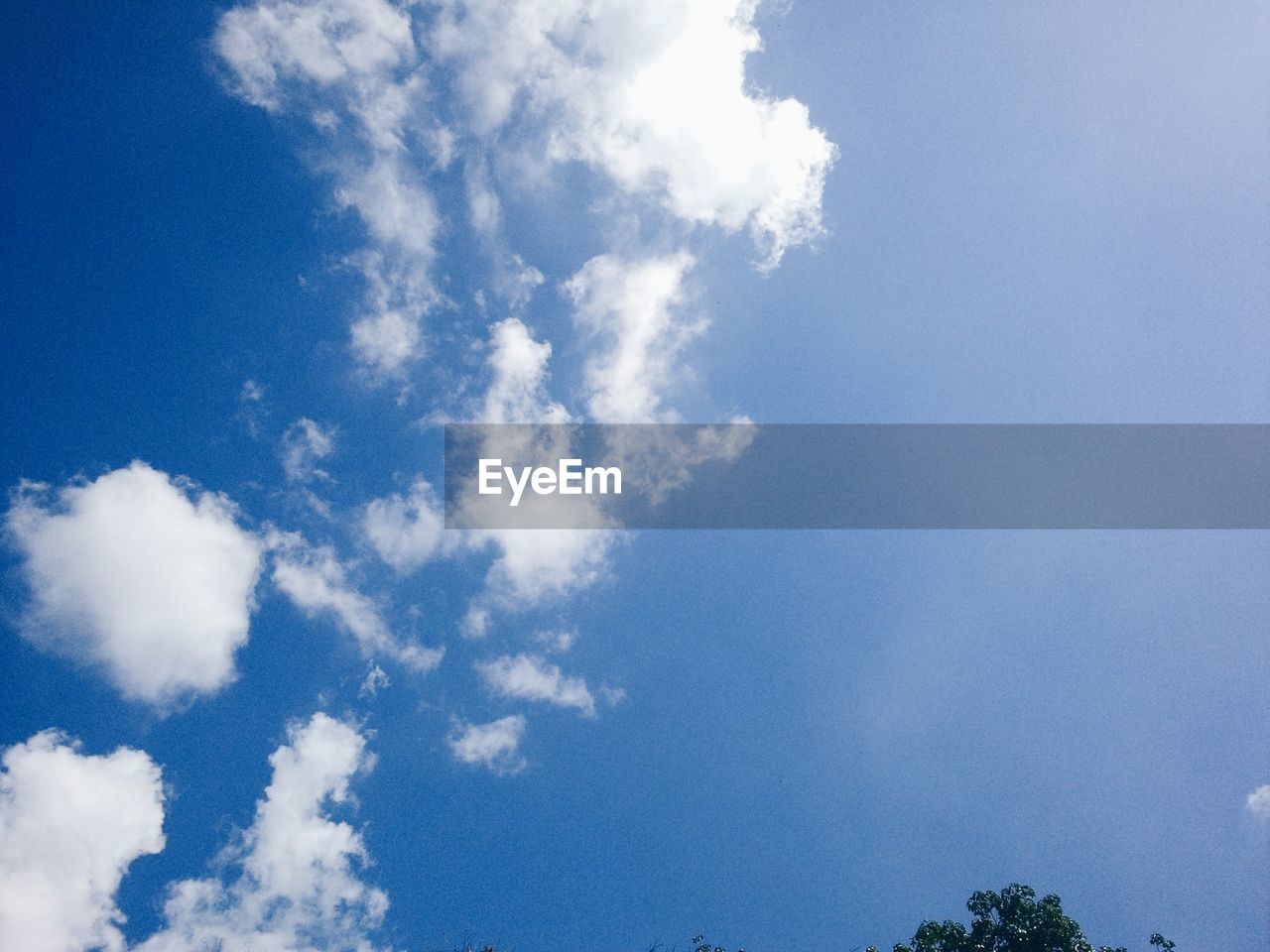 Low angle view of blue sky and clouds