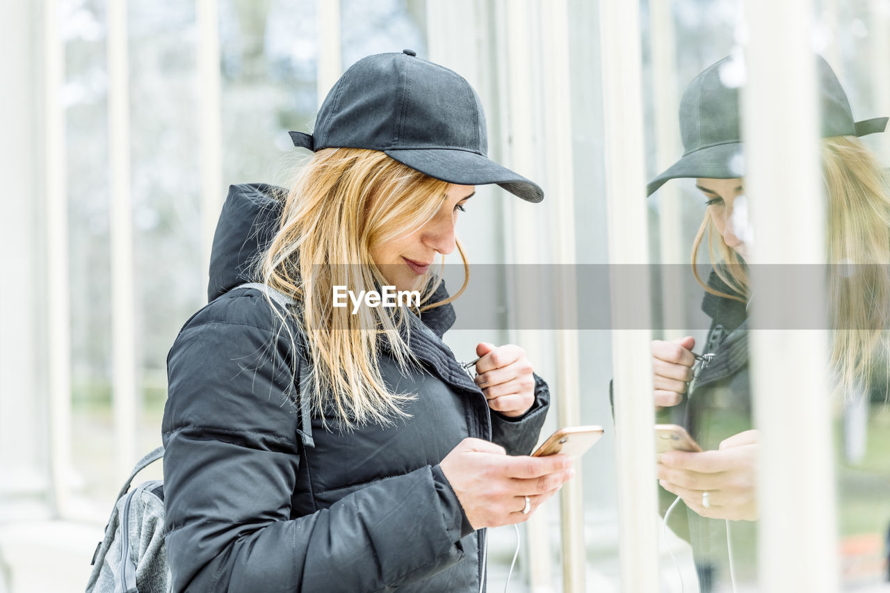 Woman listening music in city