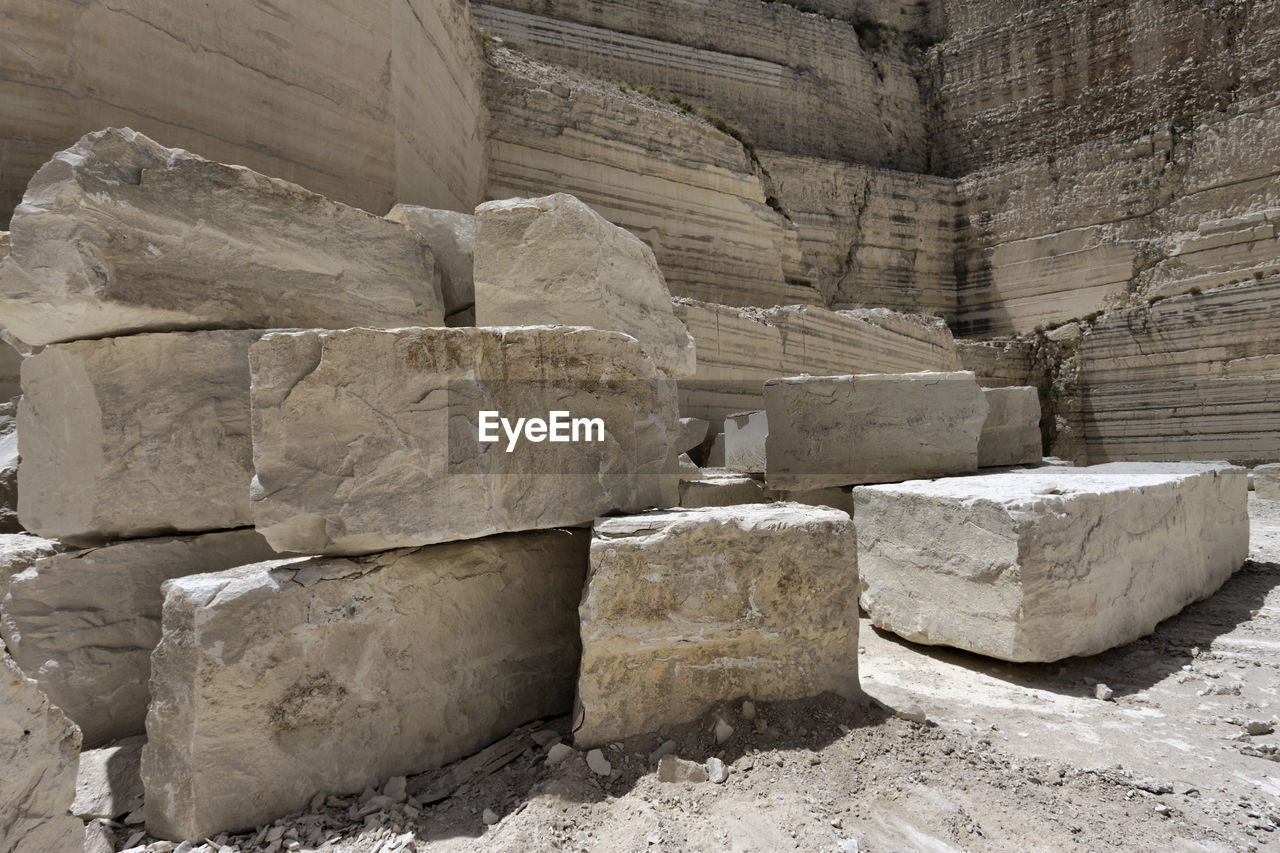STACK OF ROCKS ON STONE STRUCTURE
