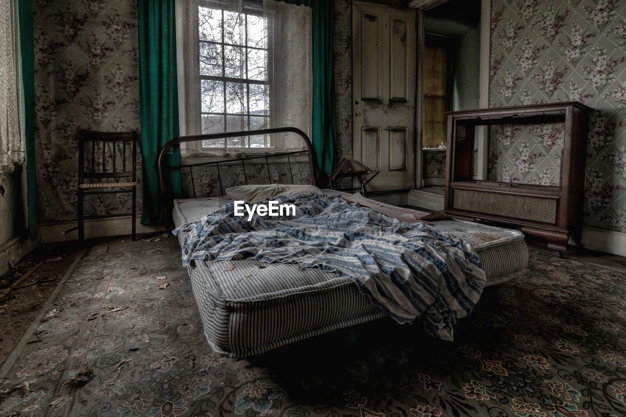 Bed in abandoned house